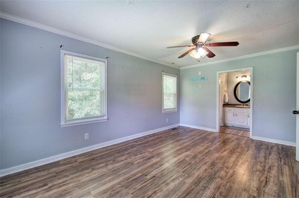 60 Lee Street Rockmart, GA 30153 - Photo 9 of 21 wooden floor in an empty room with a window
