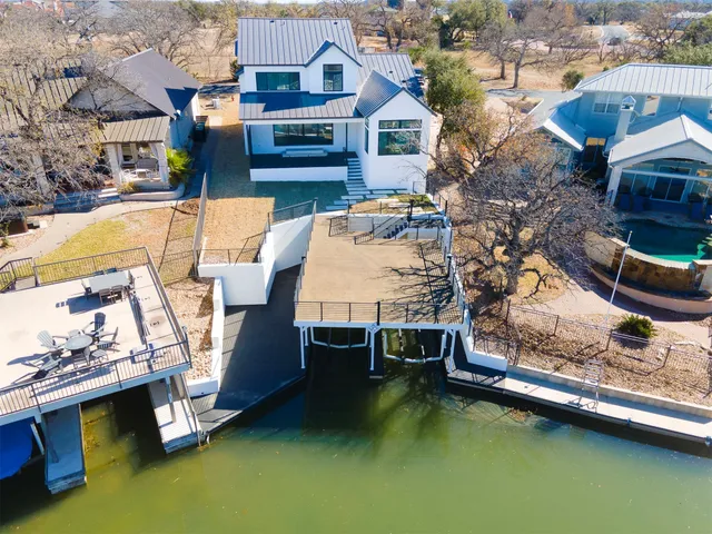 an aerial view of a house with swimming pool