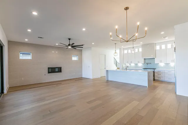 a view of a kitchen and a large window