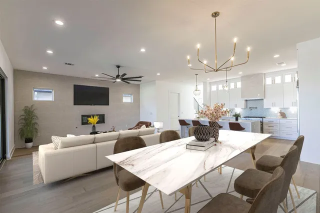 a large kitchen with a table and chairs