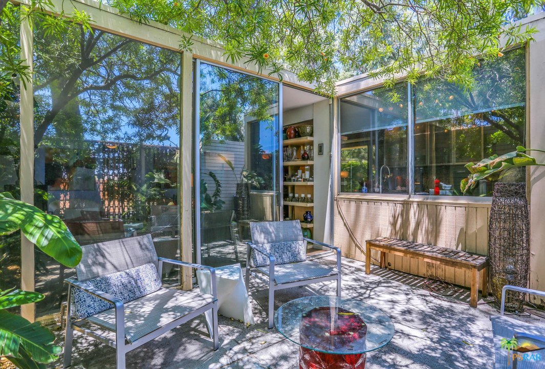 360 Cabrillo Road, Unit 105 Palm Springs, CA 92262 - Photo 20 of 49 Private patio with walls of glass.