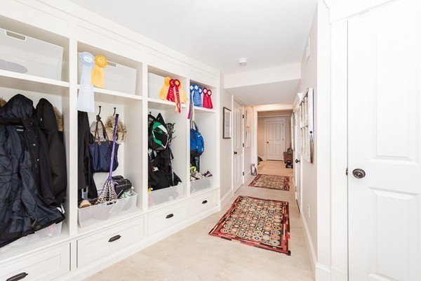 25 Forest Street Manchester, MA 01944 - Photo 12 of 24 a view of walk in closet with clothes and shoes