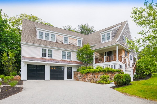 25 Forest Street Manchester, MA 01944 - Photo 2 of 24 a front view of a house with garden and plants