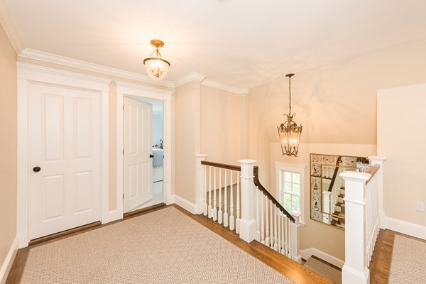 25 Forest Street Manchester, MA 01944 - Photo 21 of 24 a view of a chandelier fan and entryway