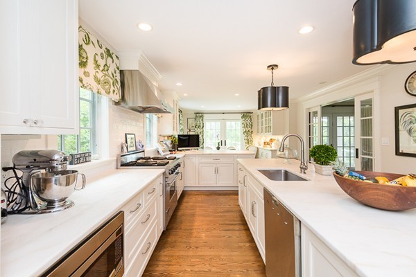 25 Forest Street Manchester, MA 01944 - Photo 6 of 24 a large white kitchen with a large window