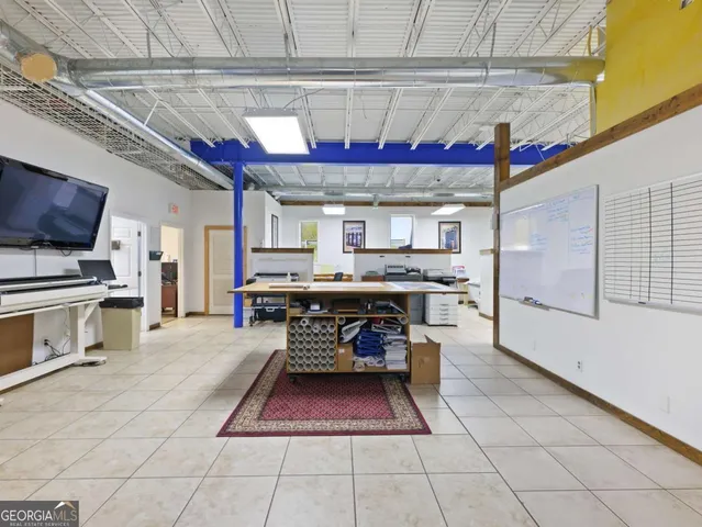 a workspace with furniture and a gate