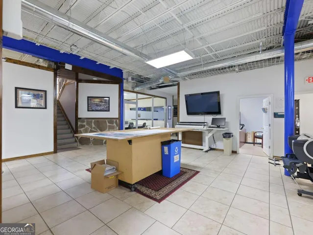 a view of a livingroom with natural light