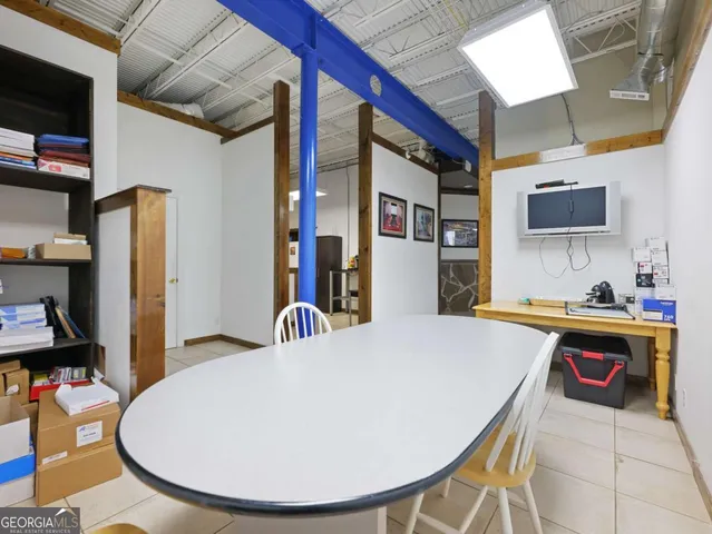 a room with lots of furniture and a chandelier