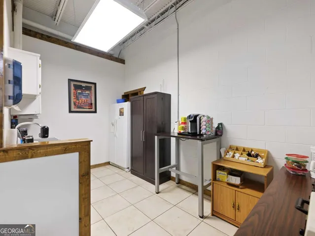 a view of a room with wooden floor and stairs