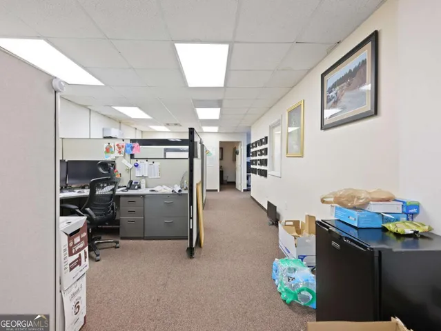 an aerial view of a house with garden space ocean view