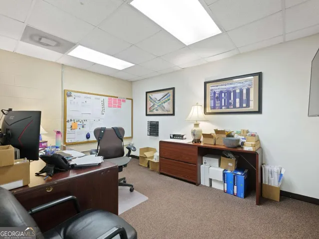 a view of a swimming pool with a yard