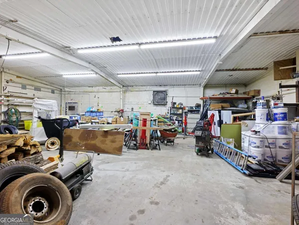 a view of a house with backyard porch and furniture