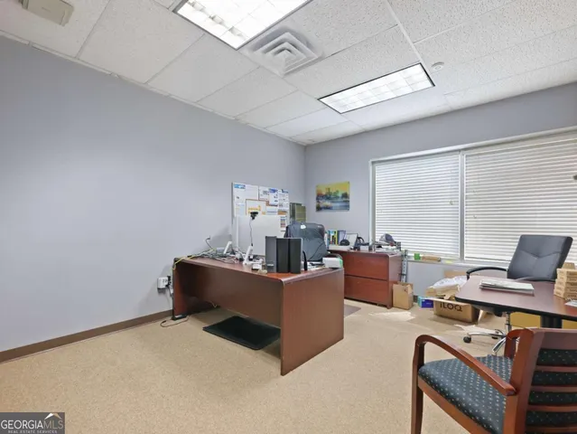 a bedroom with furniture and a window