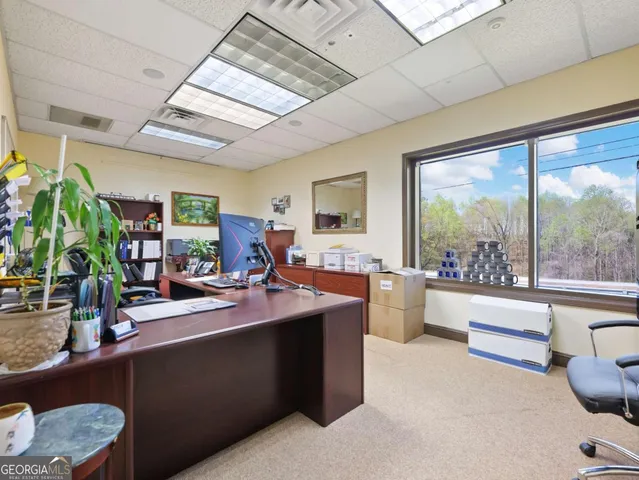 a kitchen with stainless steel appliances kitchen island granite countertop a stove a sink and a refrigerator