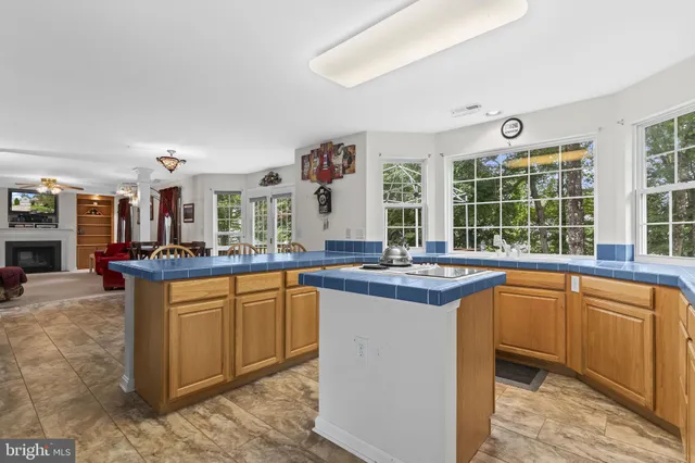 a kitchen with granite countertop a sink and cabinets