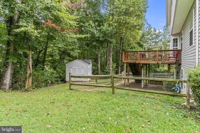 a view of a bench in a backyard
