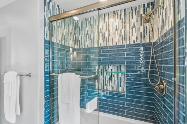 a bathroom with a toilet and shower