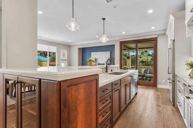 a kitchen with stainless steel appliances granite countertop a stove and a sink