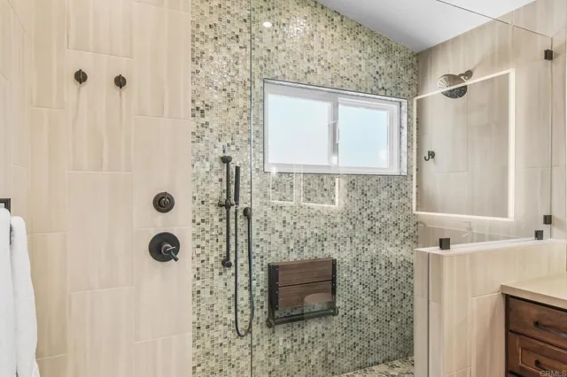 a bathroom with a shower and a sink