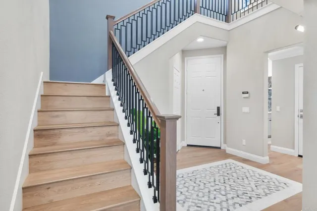 a view of an entryway with wooden floor