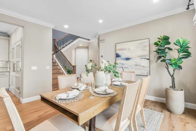 a view of a dining room with furniture window and wooden floor