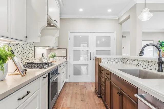 a kitchen with a stove and a sink