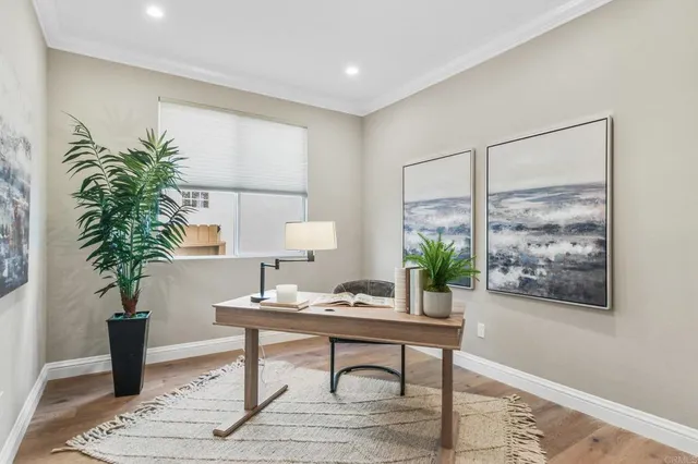 a workspace with furniture and a potted plant