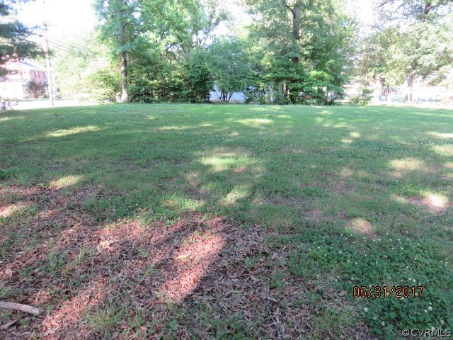 2808 West City Point Road Hopewell, VA 23860 - Photo 5 of 10 a view of outdoor space with green field and trees all around