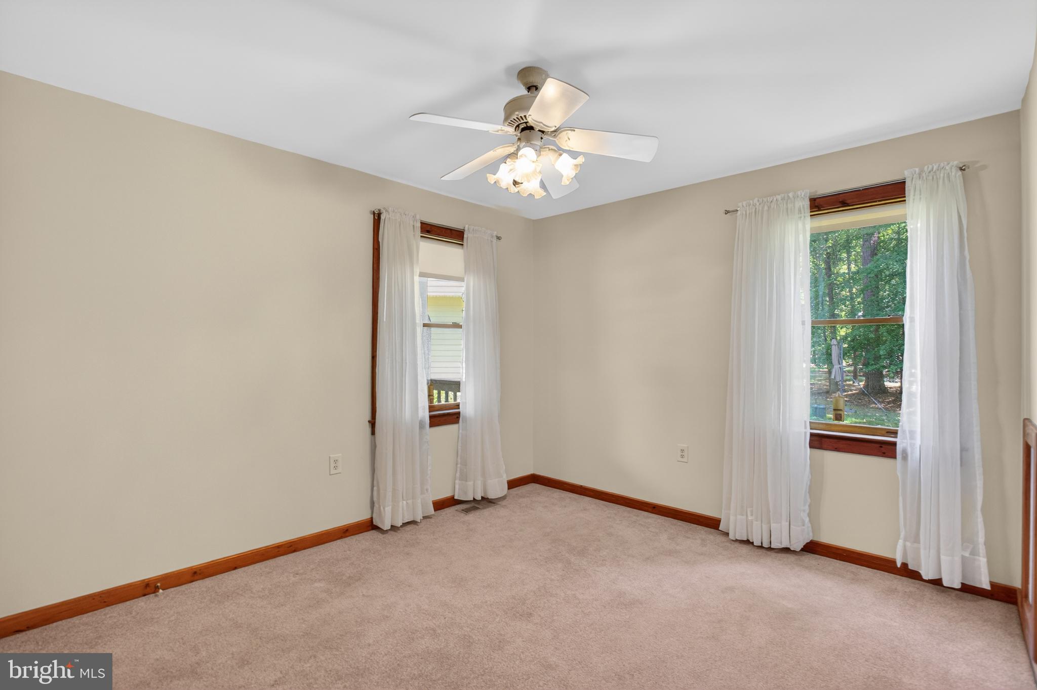 14575 Honeysuckle Way Issue, MD 20645 - Photo 8 of 49 an empty room with fan and windows