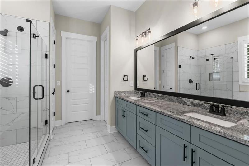 283 London Road Ball Ground, GA 30107 - Photo 29 of 73 a bathroom with a granite countertop sink mirror and double