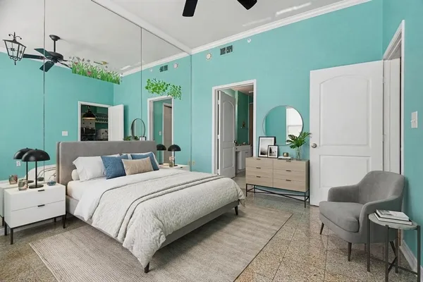 a bedroom with a bed mirror and window