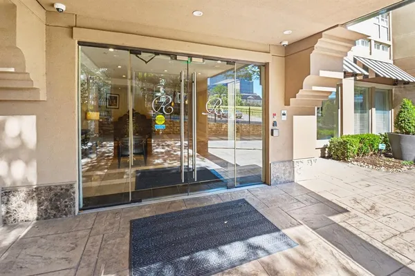 a kitchen with stainless steel appliances granite countertop a refrigerator and a stove
