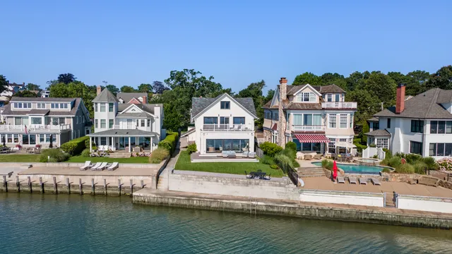 a view of houses with water and city view
