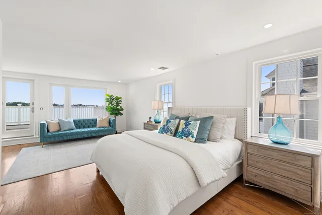 a bedroom with a large bed and a couch