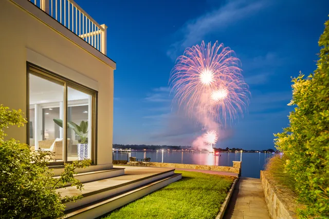 a house with swimming pool in front of it