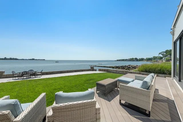 a view of swimming pool and outdoor seating
