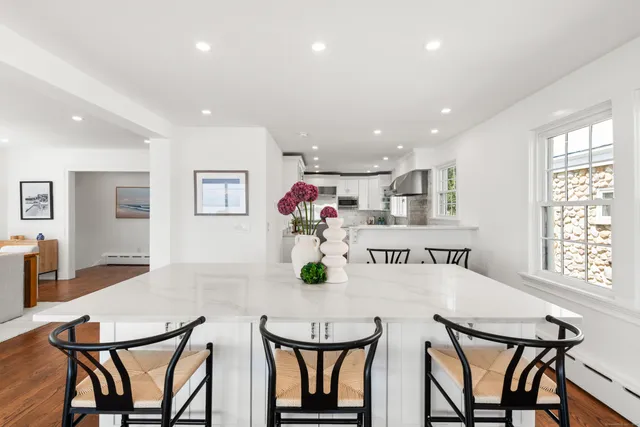 a view of a dining room with furniture and window
