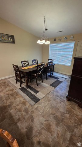 1330 North Dixie Downs Road, Unit 72 St. George, UT 84770 - Photo 13 of 21 Dining space featuring stone finish floors and a chandelier