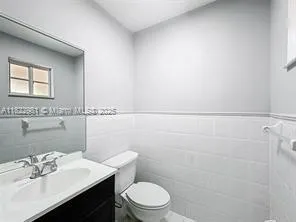 a view of a utility room with windows