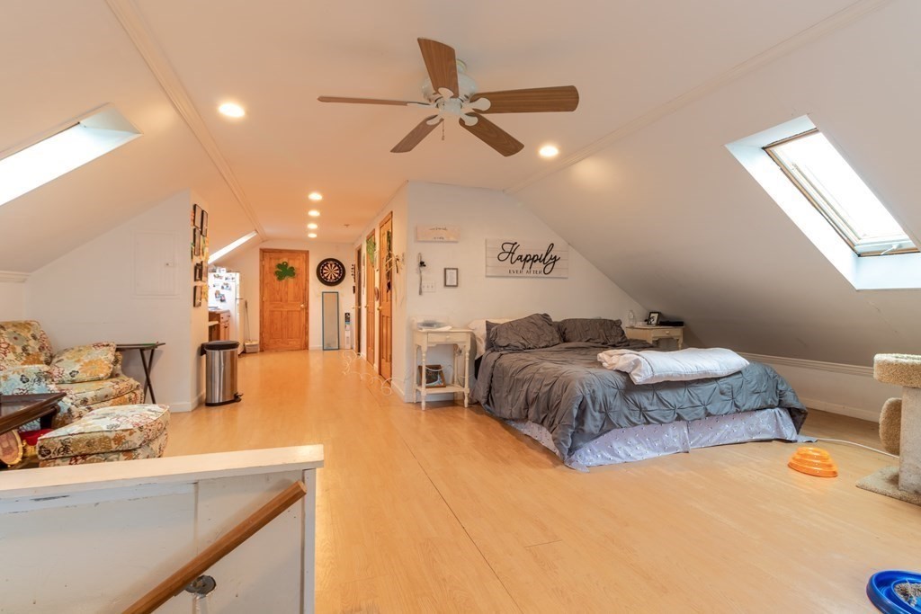 14 Dunlap Street Salem, MA 01970 - Photo 11 of 28 a bedroom with a bed and ceiling fan
