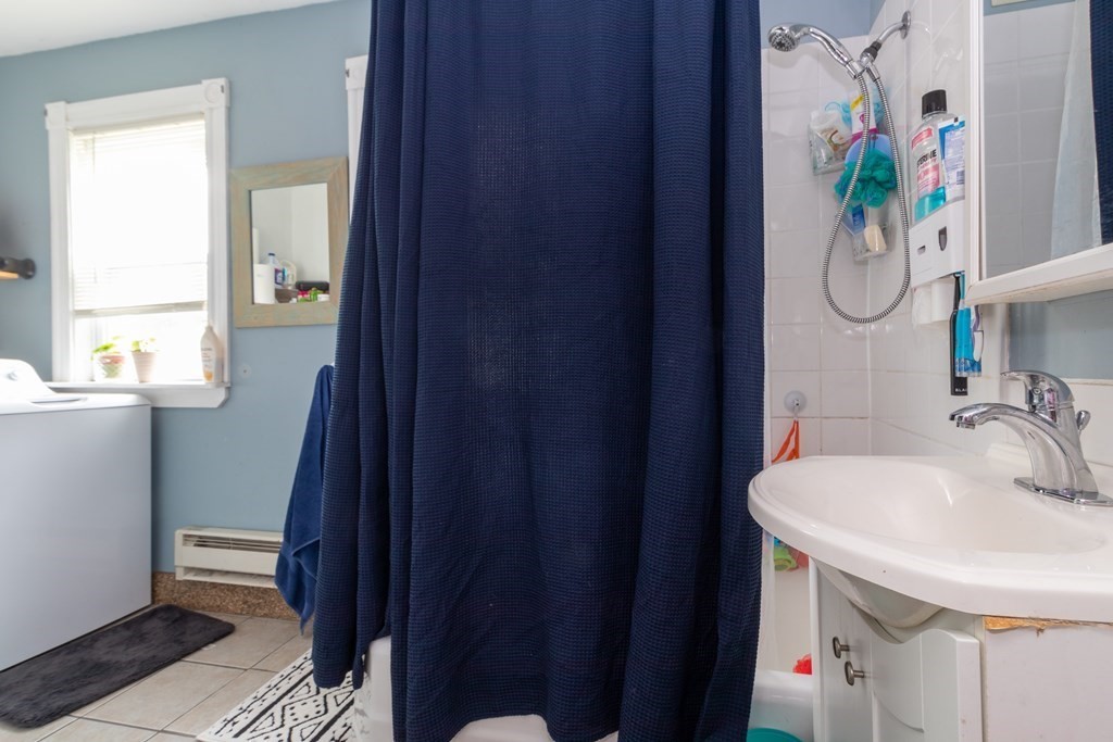 14 Dunlap Street Salem, MA 01970 - Photo 18 of 28 a bathroom with a sink and a mirror