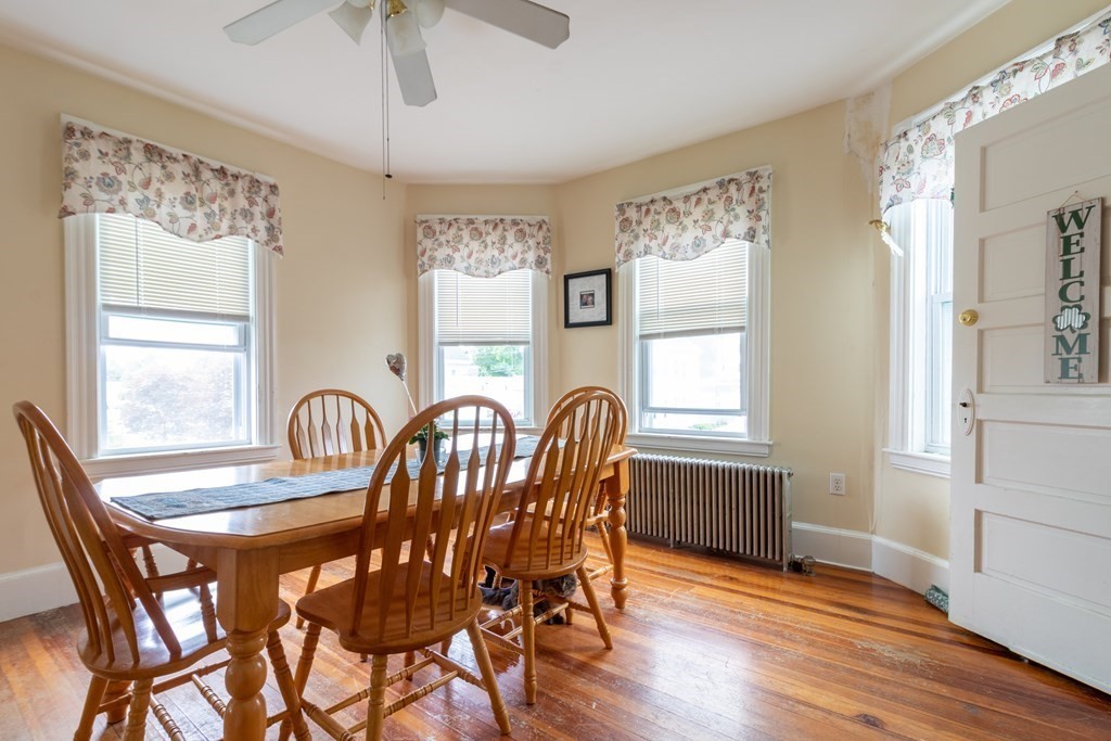 14 Dunlap Street Salem, MA 01970 - Photo 8 of 28 a dining room with furniture a chandelier and wooden floor