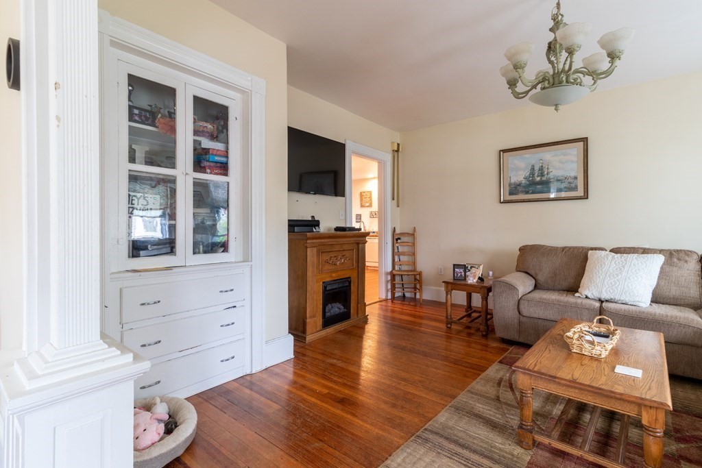 14 Dunlap Street Salem, MA 01970 - Photo 10 of 28 a living room with furniture and a flat screen tv