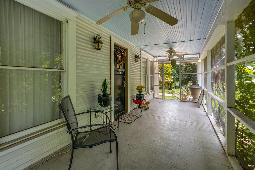 800 Harter Road Dallas, TX 75218 - Photo 9 of 17 a view of a porch with chairs and table