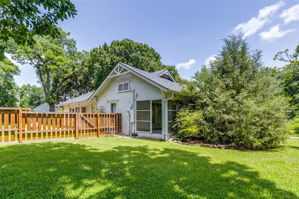 800 Harter Road Dallas, TX 75218 - Photo 10 of 17 a view of a house with a yard and a garden