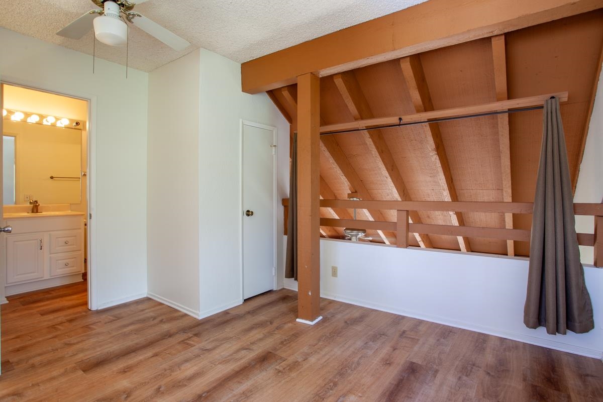 56 Davison Road, Unit 104 Mammoth Lakes, CA 93546 - Photo 12 of 22 an empty room with wooden floor and fan