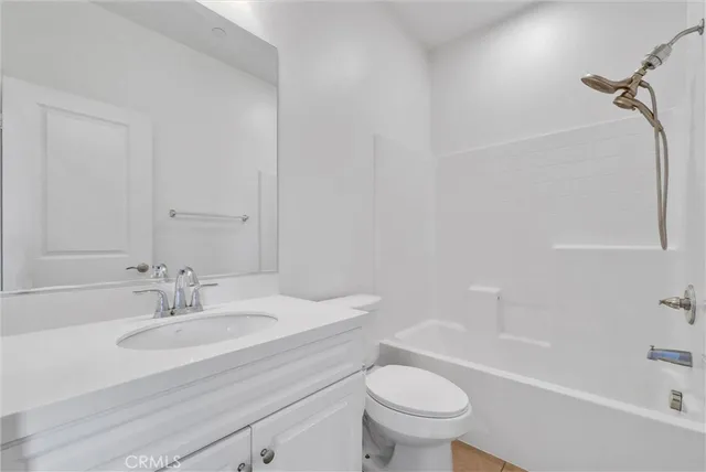 a bathroom with a sink a toilet and a bathtub