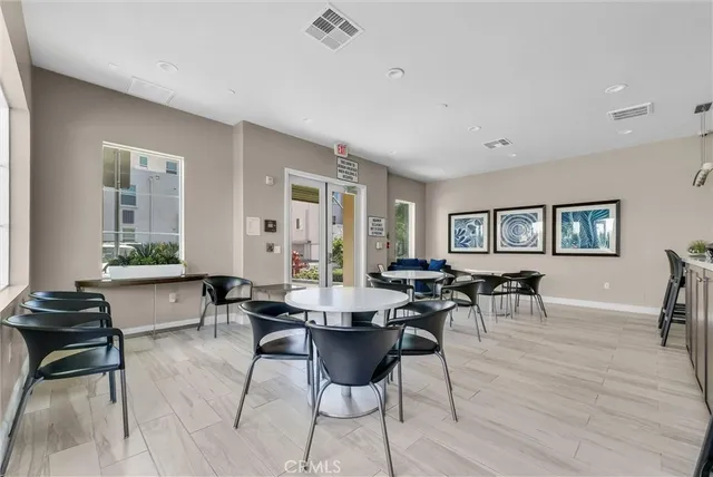 a living room with lots of furniture and a wooden floor