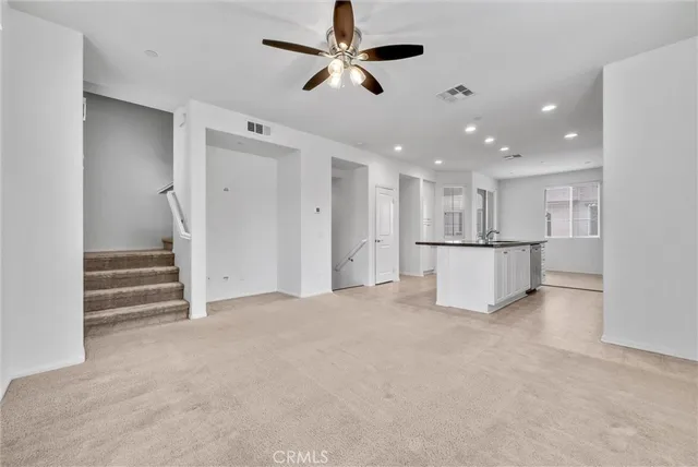 a view of a livingroom with a ceiling fan