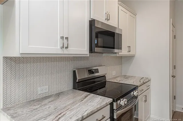 a kitchen with a stove and a microwave